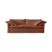 Classic Home Cassiano slip cover sofa featuring a beige fabric, plush cushions, and a sturdy stationary sofa design.