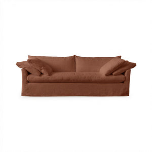 Classic Home Cassiano slip cover sofa featuring a beige fabric, plush cushions, and a sturdy stationary sofa design.