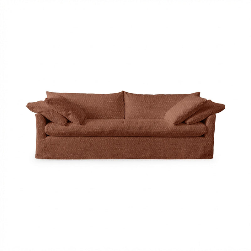 Classic Home Cassiano slip cover sofa featuring a beige fabric, plush cushions, and a sturdy stationary sofa design.