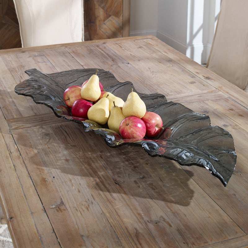 Dark gray glass tray with smoked leaf design by Uttermost, perfect for serving or decorative display.