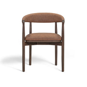 Vina vegan leather dining arm chair by TOV Furniture with sleek modern design and cushioned seat in a contemporary setting.