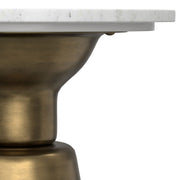 Leyla side table by Simpli-Home in antique brass finish, featuring a sleek round design with a smooth surface.