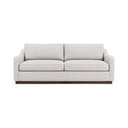 Classic Home Aspen stationary sofa with plush cushions and elegant fabric upholstery, showcasing a stylish living room setup.