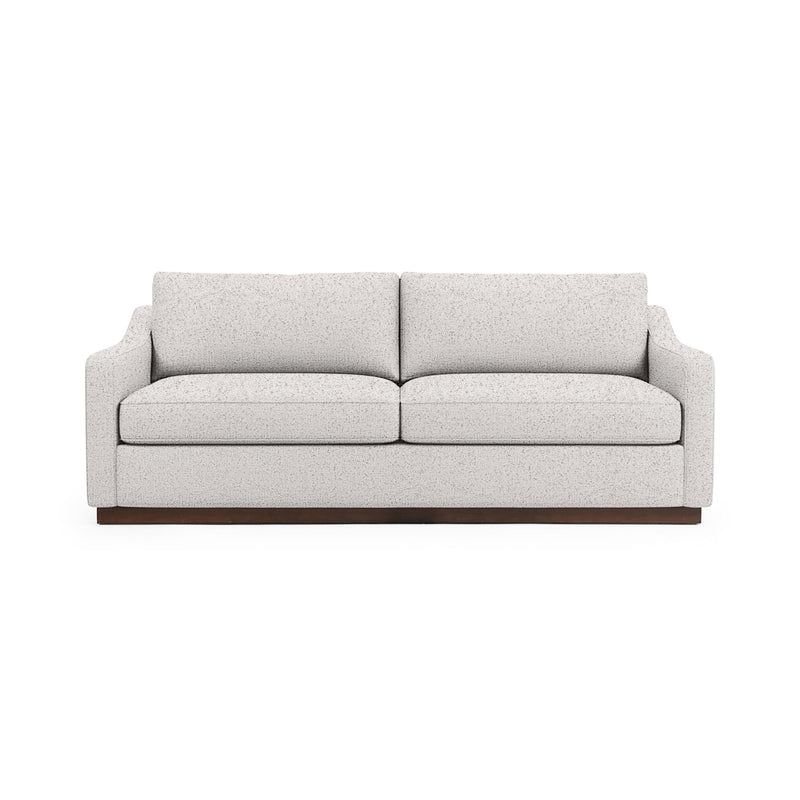 Classic Home Aspen stationary sofa with plush cushions and elegant fabric upholstery, showcasing a stylish living room setup.