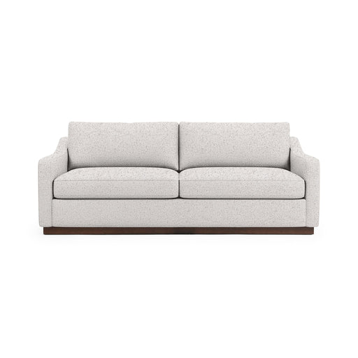 Classic Home Aspen stationary sofa with plush cushions and elegant fabric upholstery, showcasing a stylish living room setup.