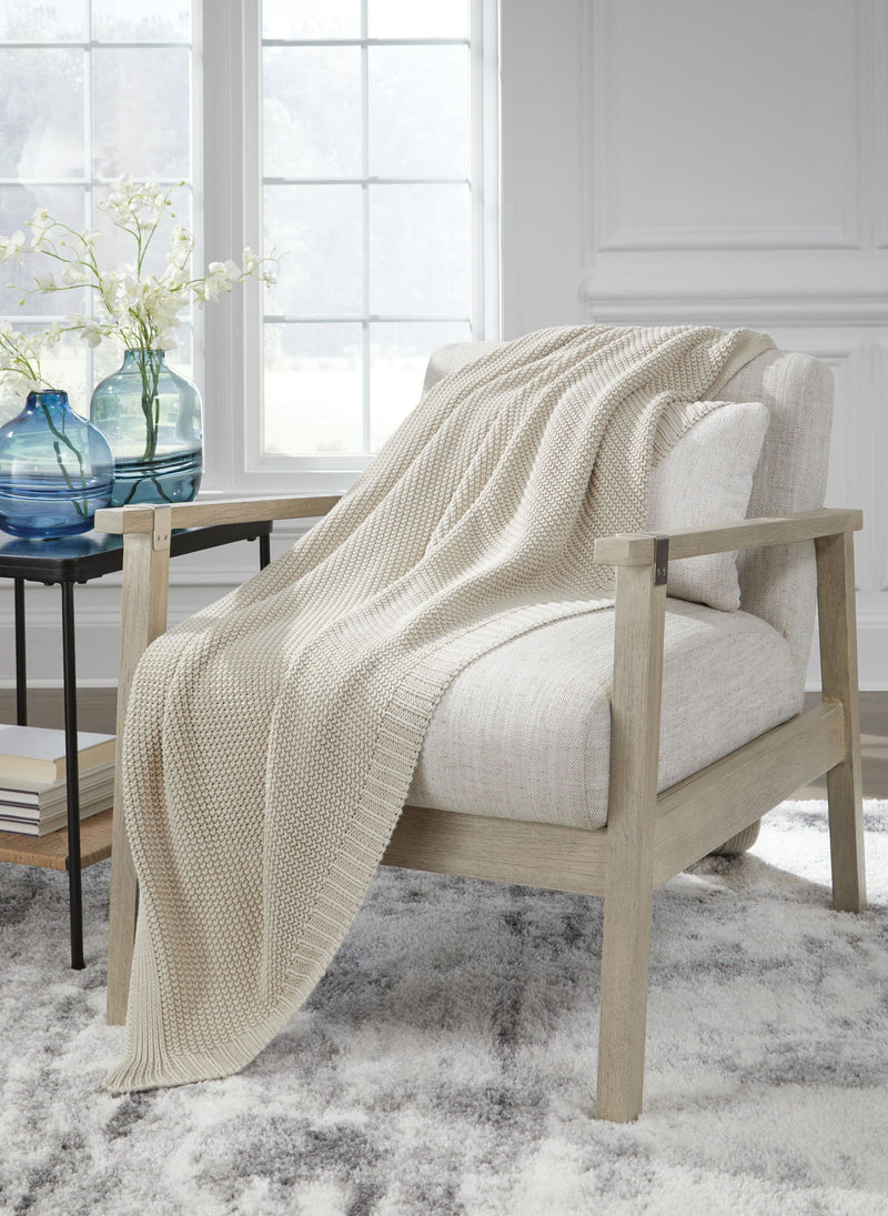 Gayelery Signature Design by Ashley® throw blanket with soft, cozy fabric and decorative fringe, perfect for adding warmth and style.