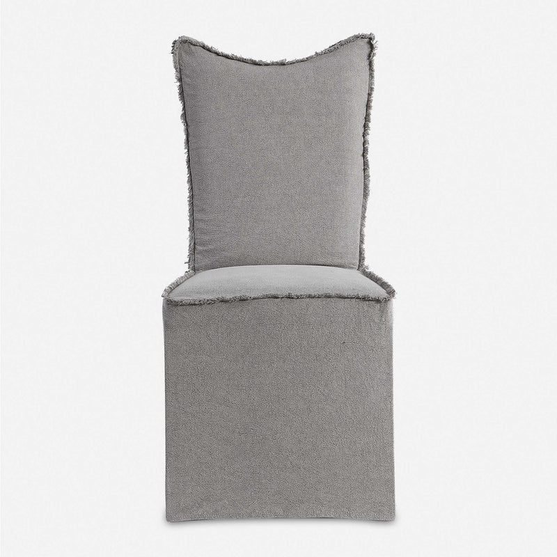 Set of two gray Narissa armless chairs by Uttermost, modern design with upholstered seats and sleek legs.