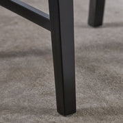 Set of two Noble House Plethora dining chairs with X-shaped back design, featuring wooden frames and upholstered seats.