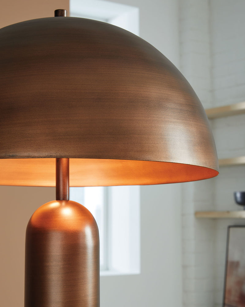 Signature Design by Ashley Wendfield metal floor lamp with a sleek, modern design and a tall, slender stand in a contemporary setting.