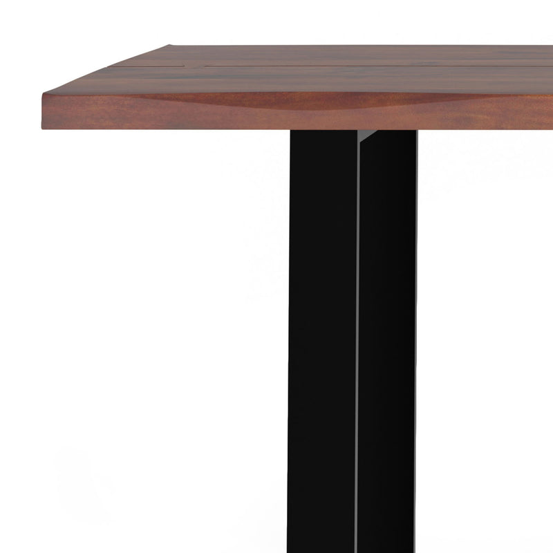Simpli-Home Fieldcrest handcrafted dining table with wooden surface and sturdy legs, ideal for family meals and gatherings.