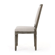 Set of Noble House traditional style dining chairs with fabric upholstery, showcasing cushioned seats and elegant wooden legs.