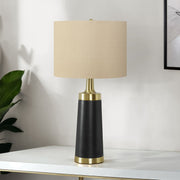Contemporary black and cream resin table lamp by 8th Street with a sleek, modern design and smooth finish.