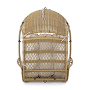 Wicker hanging chair with cushion from Noble House, ideal for relaxing indoors or outdoors in a cozy seating area.
