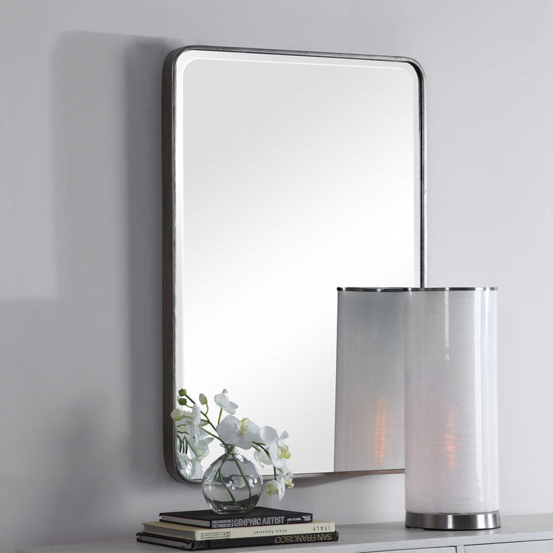 Silver wall mirror by Uttermost, Aramis design, featuring a sleek, modern frame with reflective glass surface.