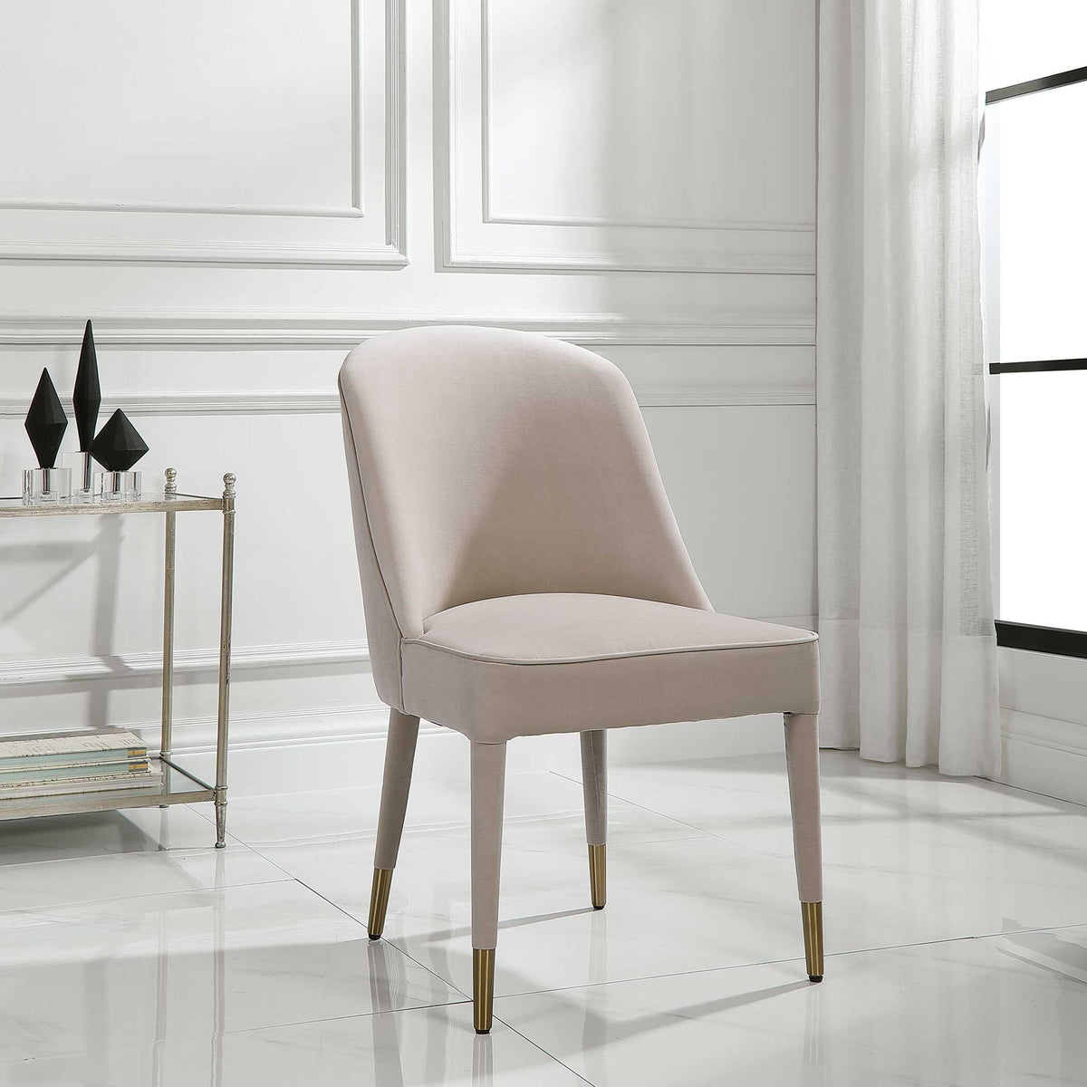 Set of two Uttermost Brie armless chairs with neutral upholstery and wooden legs, modern design for living or dining areas.