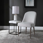 Set of two Uttermost Brie armless chairs with sleek upholstery and modern design, ideal for contemporary living spaces.