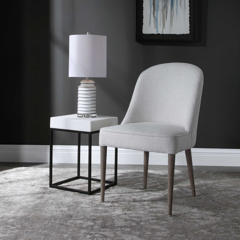 Set of two Uttermost Brie armless chairs with sleek upholstery and modern design, ideal for contemporary living spaces.