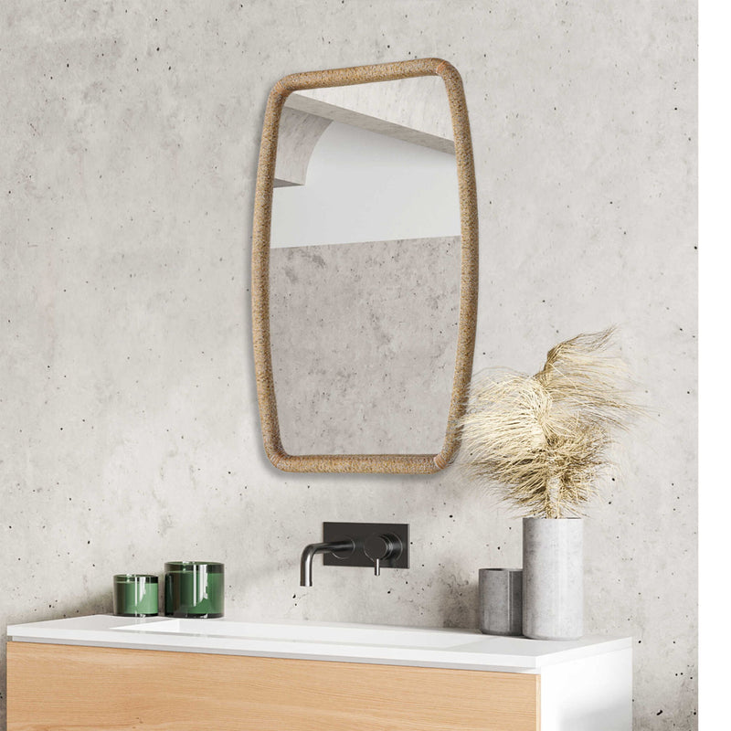 Gold Tiki accent mirror by Uttermost featuring a stylish Tiki design with a circular mirror and decorative gold frame.