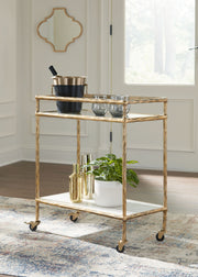 Plattfield - Bar Cart - Antique Gold Finish - R&R Furniture Gallery (Fountain Valley, CA)