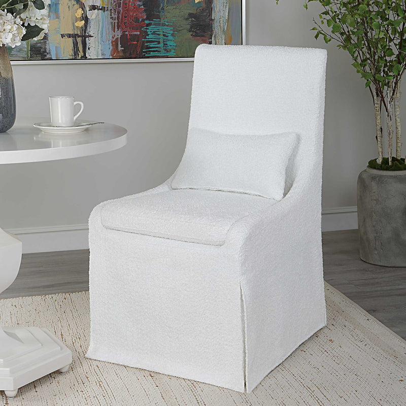 Uttermost Coley armless side chair with upholstered seat and wooden legs, modern design for living or dining spaces.