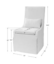 Uttermost Coley armless side chair with upholstered seat and wooden legs, modern design and neutral fabric finish.