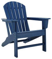 Signature Design by Ashley Sundown Treasure outdoor Adirondack arm chair with wide armrests and rustic finish in a natural setting