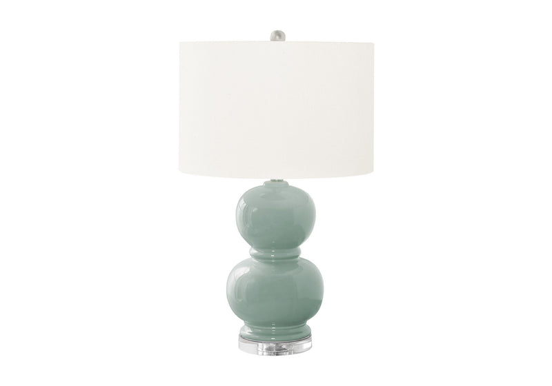 Modern 8th Street contemporary table lamp with sleek design and neutral-colored shade, perfect for living room or bedside lighting.