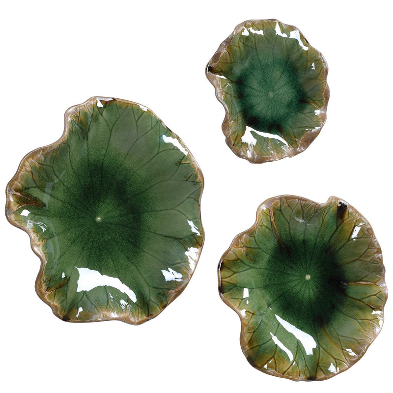 Set of three ceramic wall decor pieces by Uttermost, featuring elegant, handcrafted designs for stylish interior wall accents.