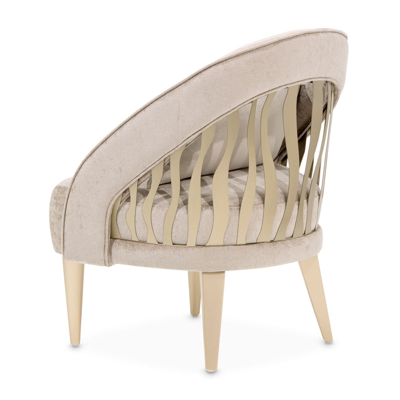 Michael Amini La Rachelle Flame Chair, elegant accent chair with a fiery orange and red upholstery and ornate wooden legs.