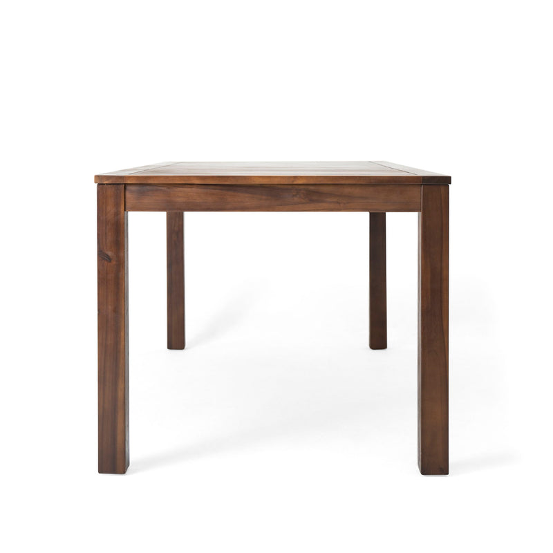 Dark brown acacia wood outdoor dining table with slatted top by Noble House, perfect for patio or garden gatherings.