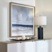 Uttermost Distant Land framed print featuring a blue landscape design on a white background.