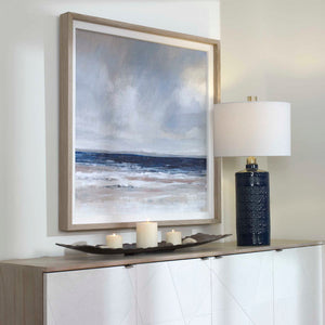Uttermost Distant Land framed print featuring a blue landscape design on a white background.