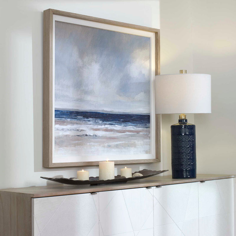 Uttermost Distant Land framed print featuring a blue landscape design on a white background.
