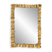 Gold Lev accent mirror by Uttermost featuring a sleek, circular design with a reflective glass surface.