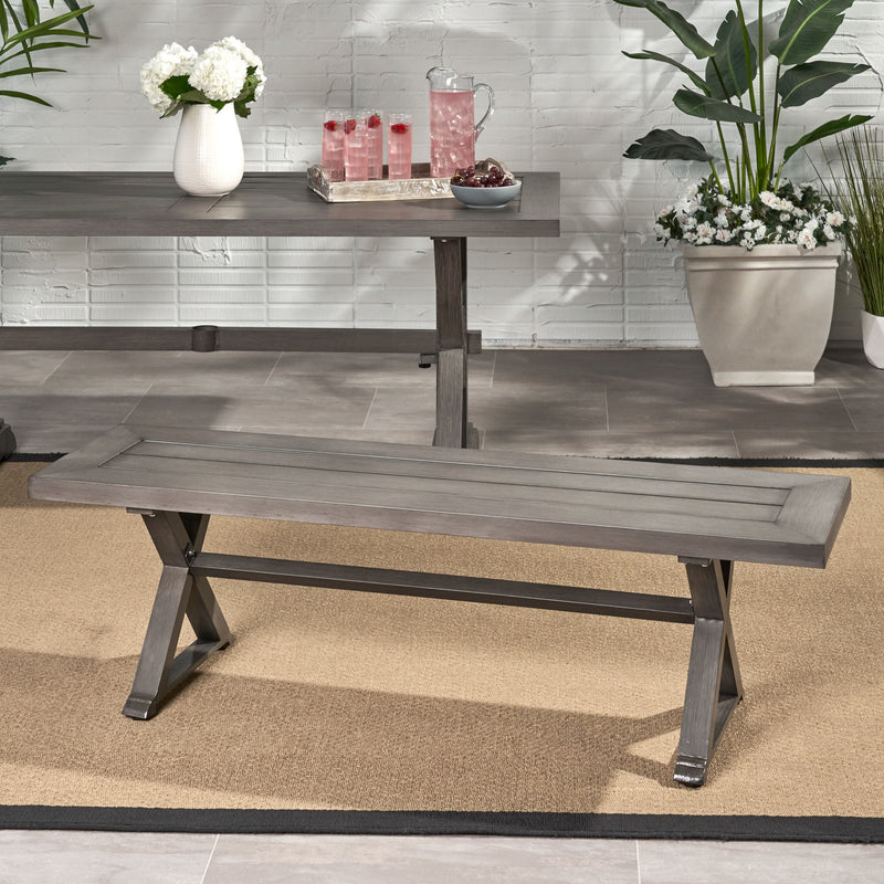 Dark gray modern aluminum outdoor dining bench with X base by Noble House, showing sleek, durable seating for outdoor spaces.