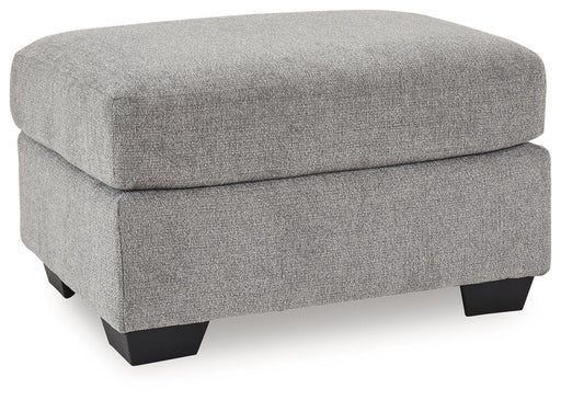 Benchcraft® upholstered Ottoman with plush fabric, featuring a rectangular shape and wooden legs for stylish comfort.