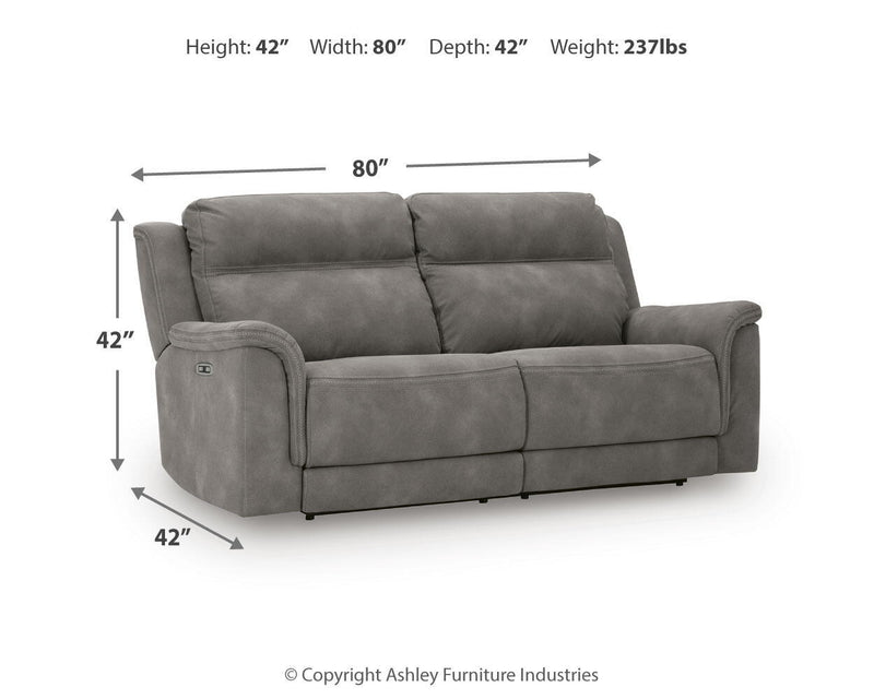 Signature Design by Ashley Durapella reclining power sofa with plush cushions and leather upholstery, shown in a modern living room setting.