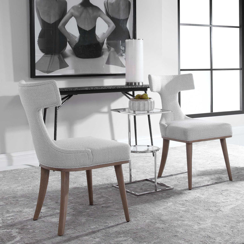 Pair of white Uttermost Klismos accent chairs with curved wooden legs and elegant design, set of two for stylish seating.