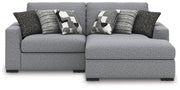 Benchcraft Bealton stationary sectional sofa with beige fabric upholstery and plush cushions in a modern living room setting.