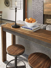 Torjin - 3 Pc. - Long Counter Table, 2 Stools - Dark Brown - R&R Furniture Gallery (Fountain Valley, CA)