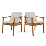 Set of two Noble House outdoor dining chairs with metal frames and woven seats, suitable for patio or garden dining areas.