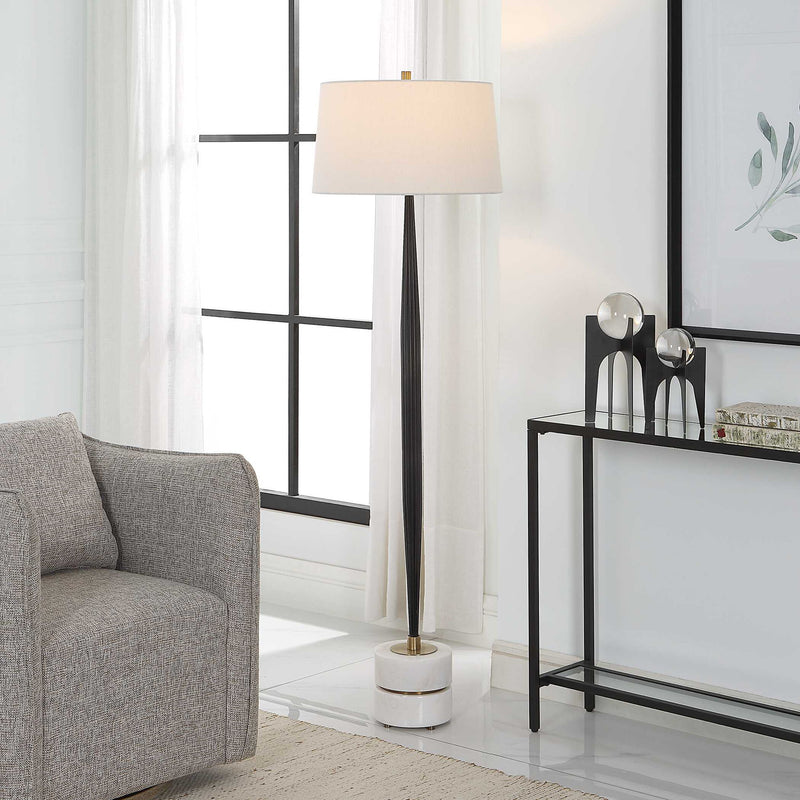 Uttermost Miraz black floor lamp with a sleek, modern design and a tall standing base, ideal for contemporary living spaces.