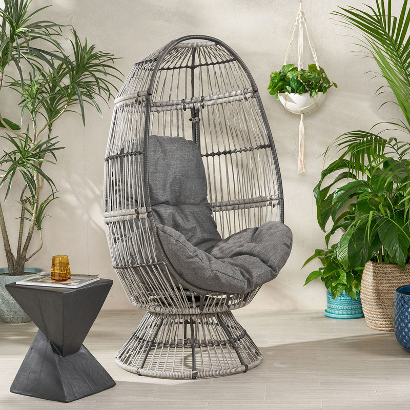 Noble House patio swivel basket egg chair with cushion, accent chair featuring a woven basket design and comfortable seat cushion.