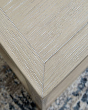 Marxhart - Square End Table - Bisque - R&R Furniture Gallery (Fountain Valley, CA)