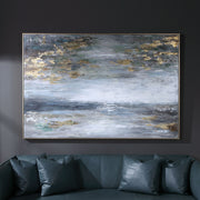 Hand painted blue canvas art by Uttermost featuring a dawn to dusk landscape in vibrant colors.
