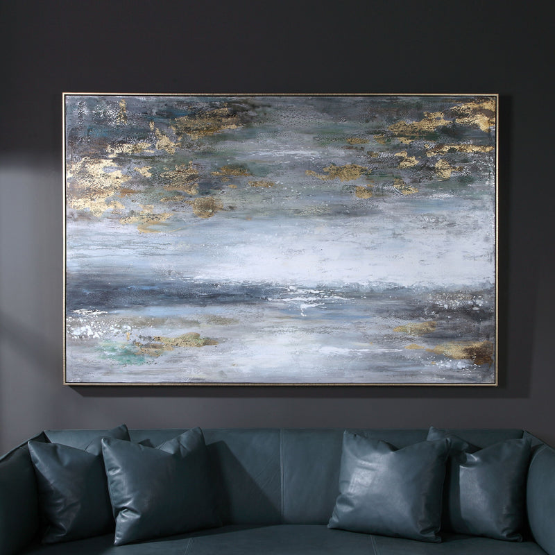 Hand painted blue canvas art by Uttermost featuring a dawn to dusk landscape in vibrant colors.
