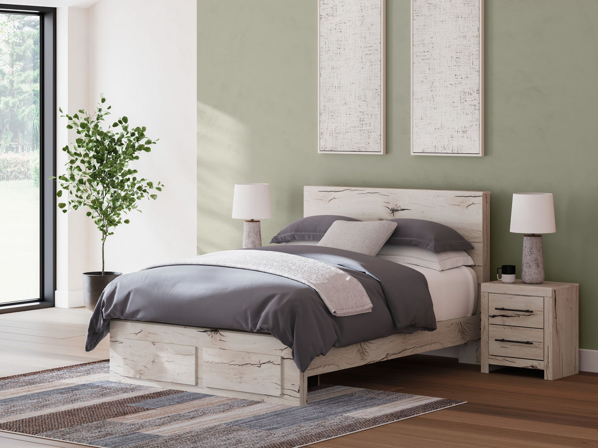 Signature Design by Ashley Lawroy panel bed with built-in storage drawers in a modern bedroom setting.