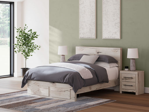 Signature Design by Ashley Lawroy panel bed with built-in storage drawers in a modern bedroom setting.