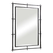 Industrial black wall mirror by Uttermost with a metal frame, perfect for modern or industrial decor styles.