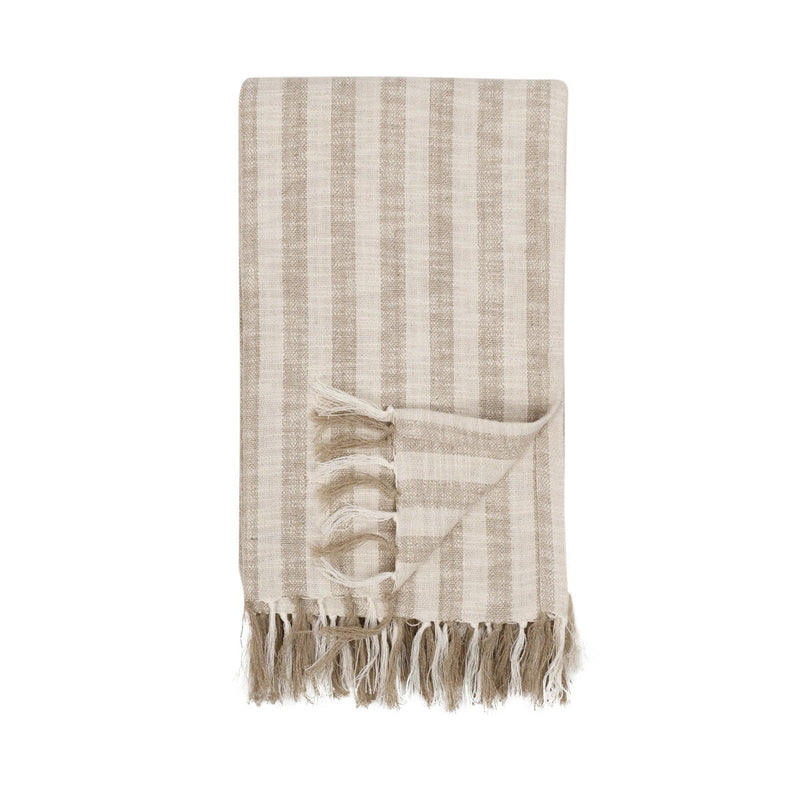 Classic Home Linna 50x70-inch ivory and natural throw blanket draped over a sofa for cozy home decor.